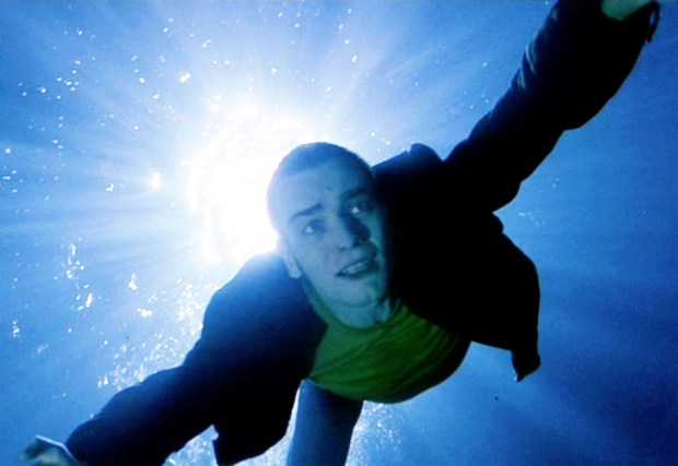 The movie “Trainspotting”, based on the novel by Irvine Welsh, directed by Danny Boyle. Seen here, Ewan McGregor (as Mark Renton, aka: "Rent Boy"). In an imaginative scene, Rent Boy dives and swims in the toilet bowl to retrieve opium suppository. Theatrical release in United Kingdom, February 23, 1996. Screen capture. Copyright © 1995 Channel Four Television Corporation. Credit: © 1995 Channel Four Films / Courtesy: Pyxurz